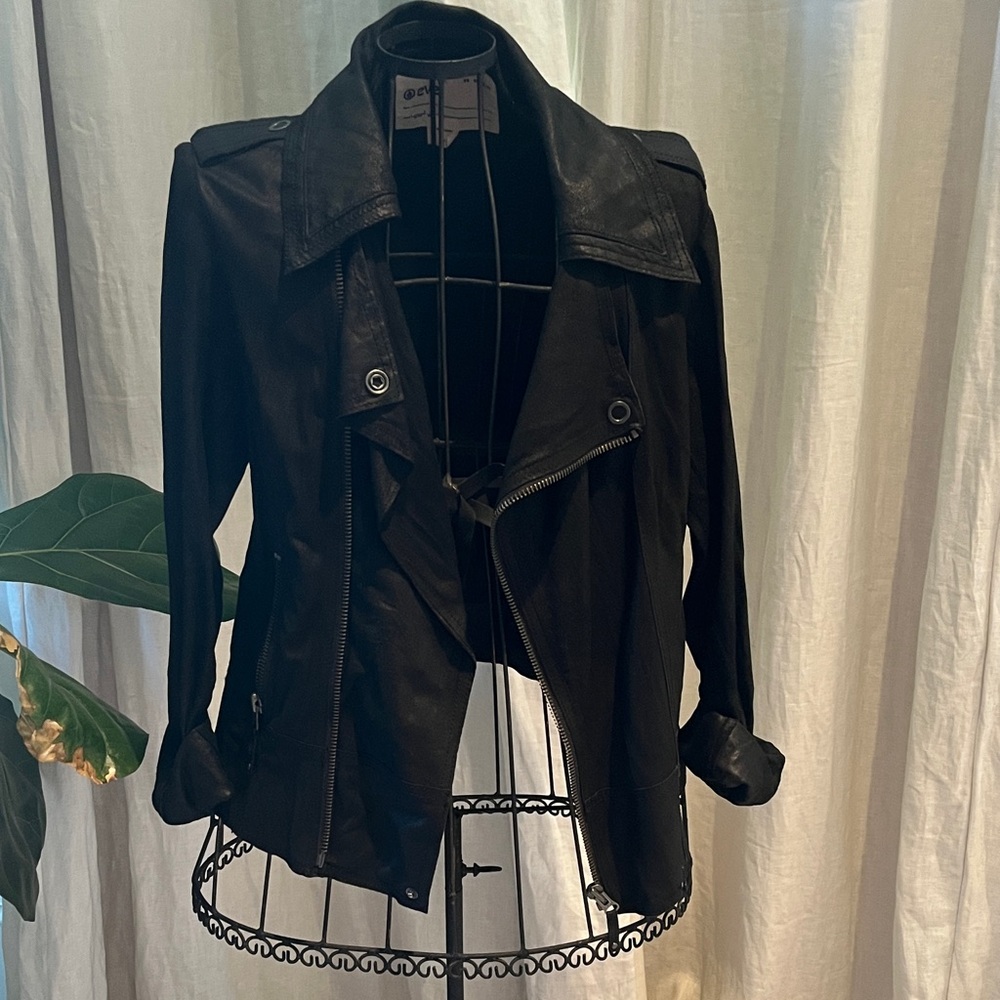 Barney’s black leather motto jacket.